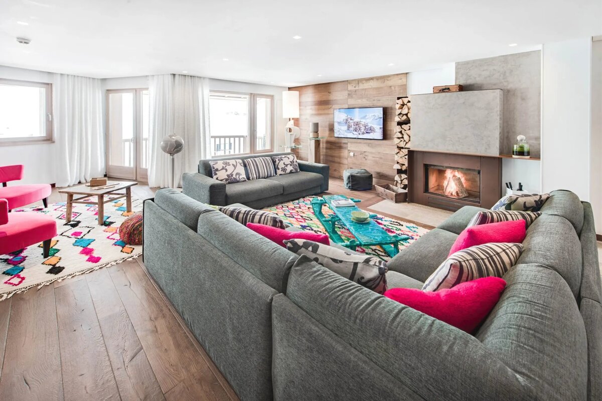 A living room filled with furniture and a fireplace