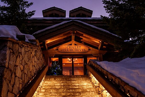 The chalet courchevel is lit up at night