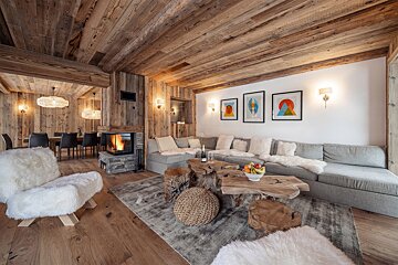 A living room with a fireplace and a couch