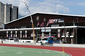 A wooden-clad sports complex with a 