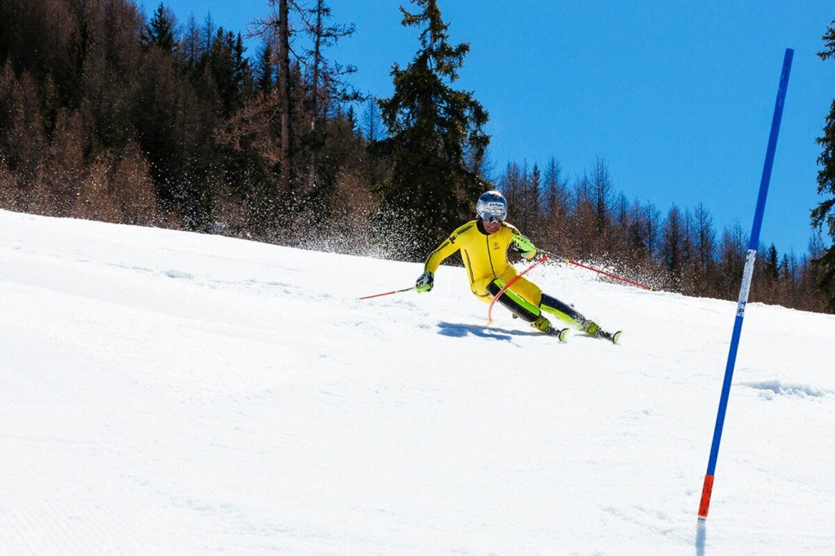 a ski racer in head to toe yellow