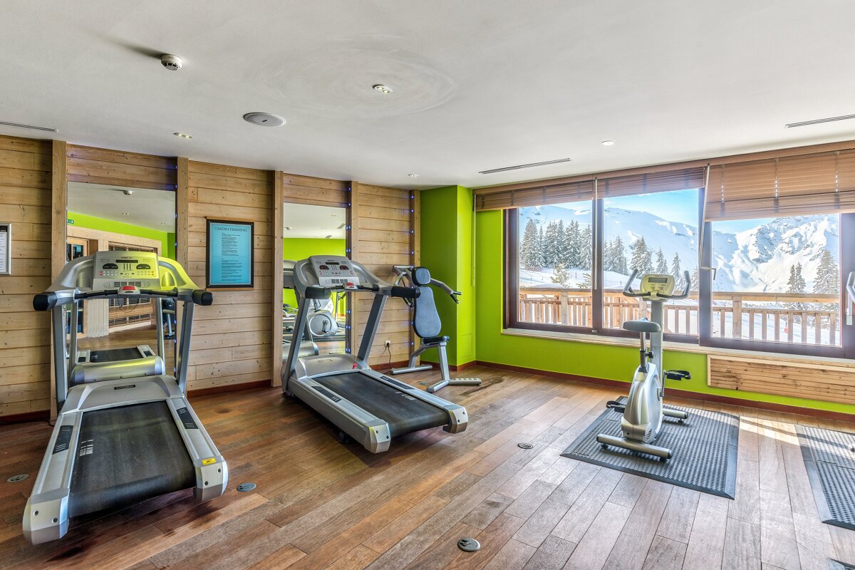 A gym with treadmills and an exercise bike