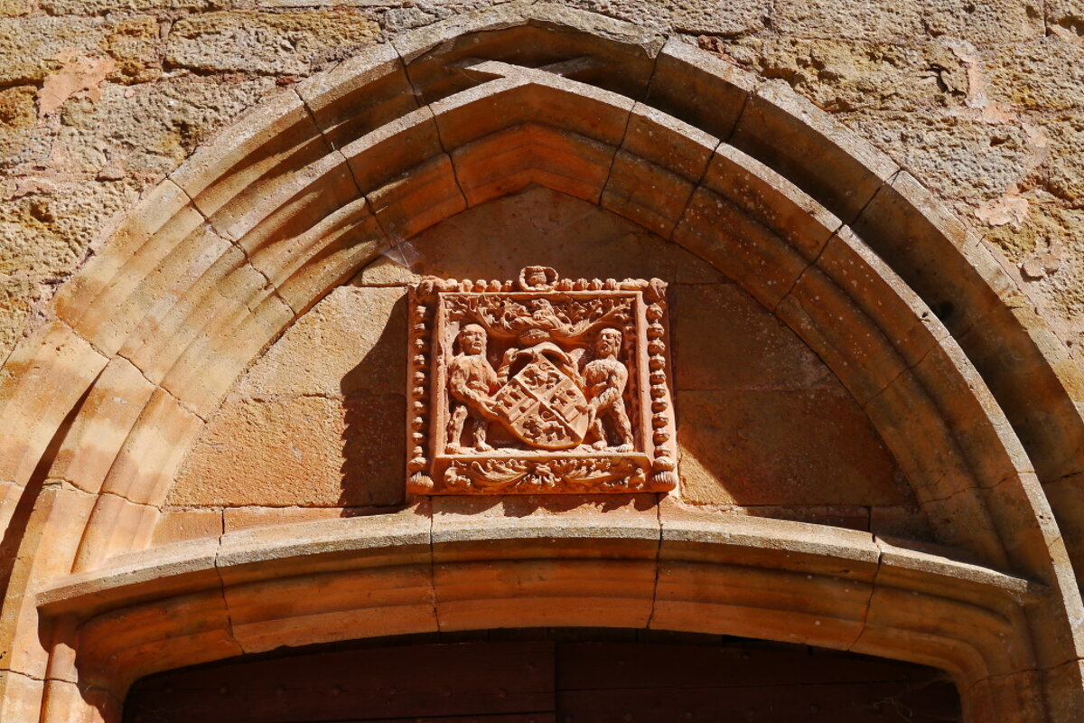 a stone sculpture above the church door at castelanu