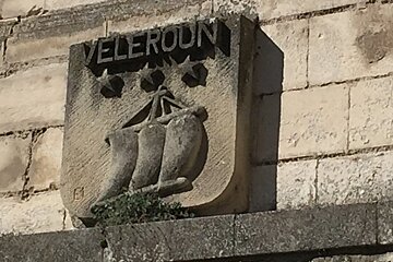 a stone village name sign
