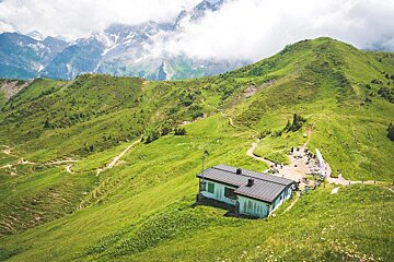 Cabane du Col de Cou in summer on green pasture