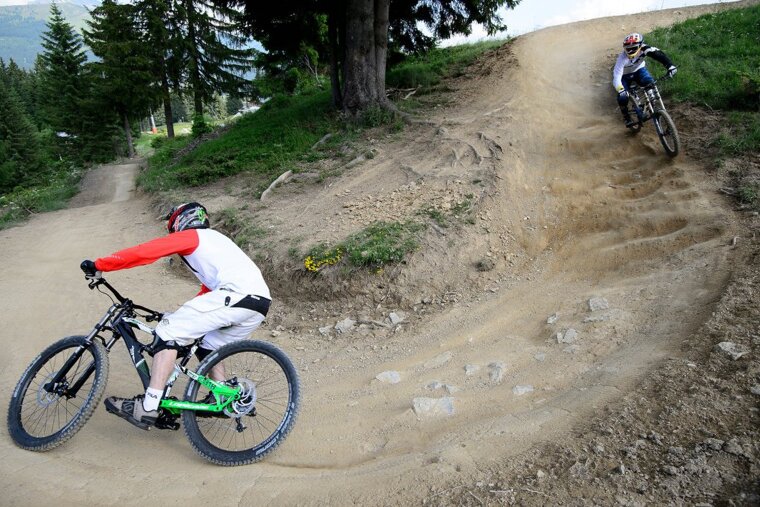 two mountain bikers on a trail