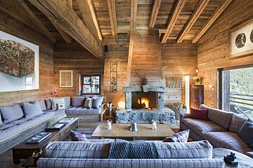 A living room filled with furniture and a fireplace