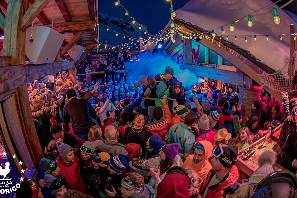A crowd of people are gathered at a cocorico party