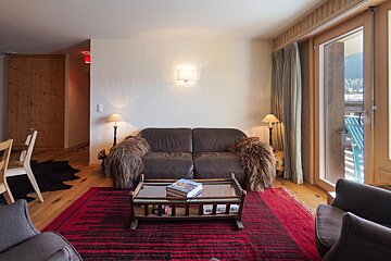 A living room with a couch and a coffee table