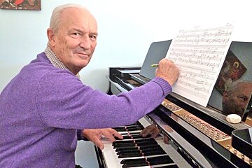 photo of man at piano