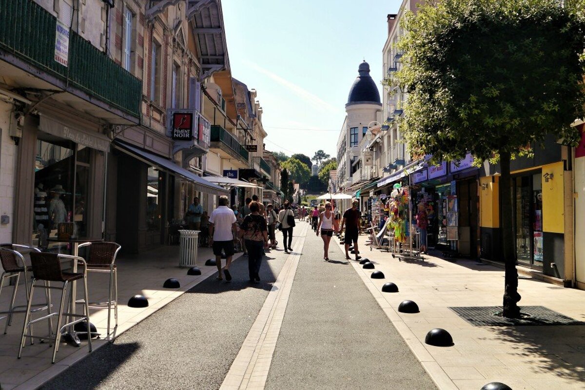 a pedestrian street with shops & cafes in arcachon