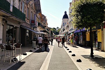 a pedestrian street with shops & cafes in arcachon