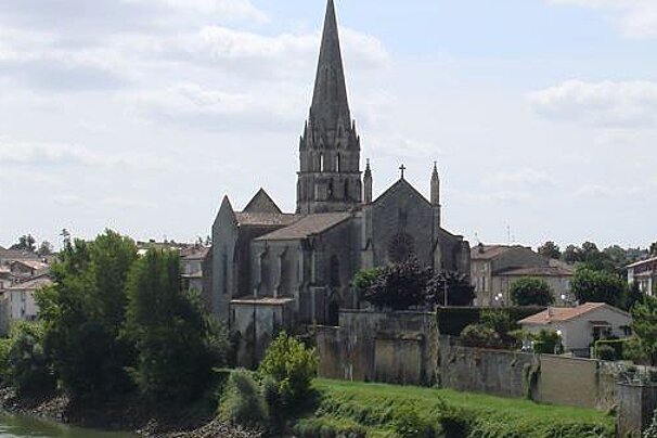 View over a river to a Gothic church