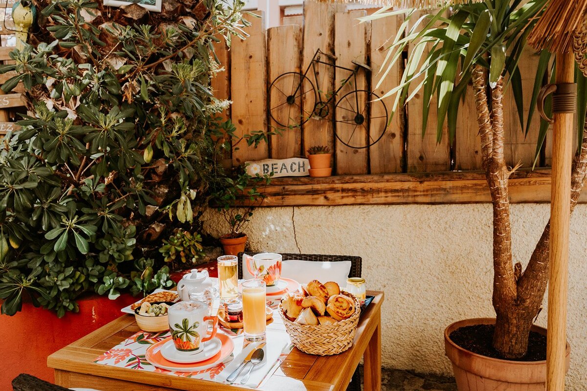 A wooden fence with a sign that says beach on it
