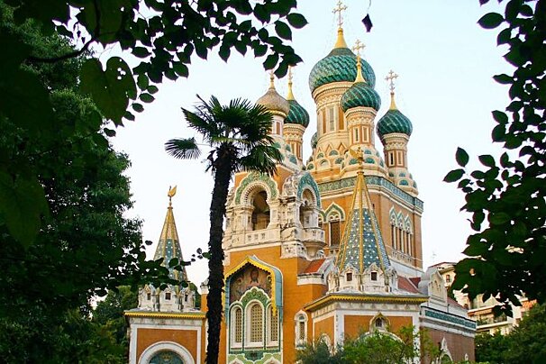 A church with a palm tree in front of it