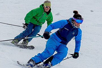 a ski instructor giving a private lesson