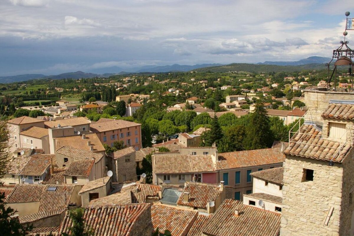 A tower with a bell on top of it that says ' a ' on it