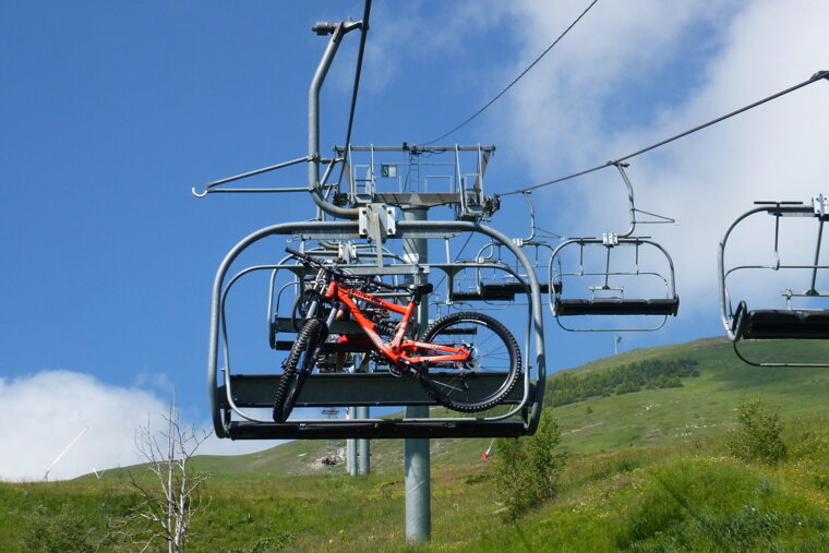 a mountain bike on a chair lift