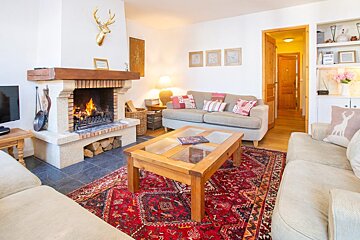 A living room with a fireplace and a couch