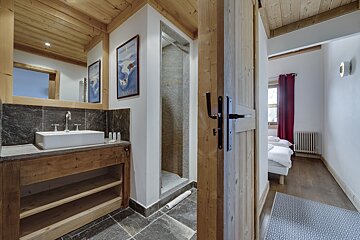 A bathroom with a sink and a painting on the wall that says france