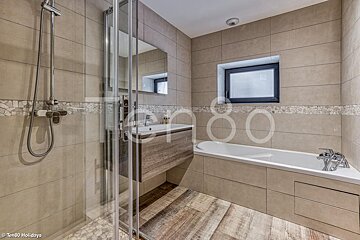 A bathroom with the number 80 on the wall