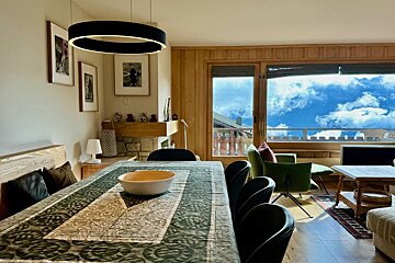A dining room table with a bowl on it