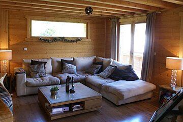 A living room with a couch and a coffee table