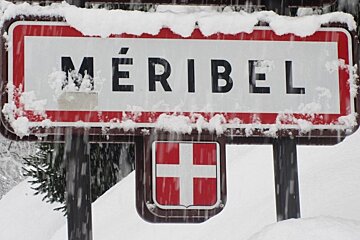 Meribel town sign in snow