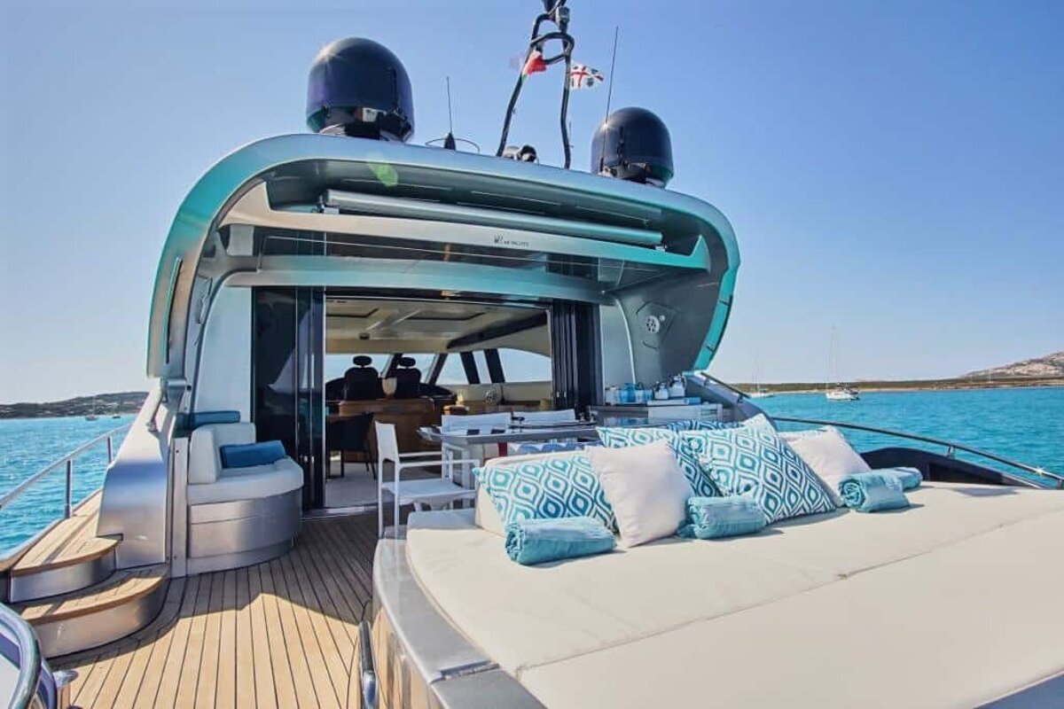 The back of a yacht with a british flag on top of it