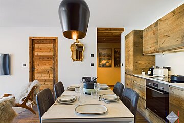 A dining room table with plates and utensils and a sign that says rental design