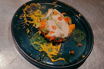 A close up of a plate of food on a table