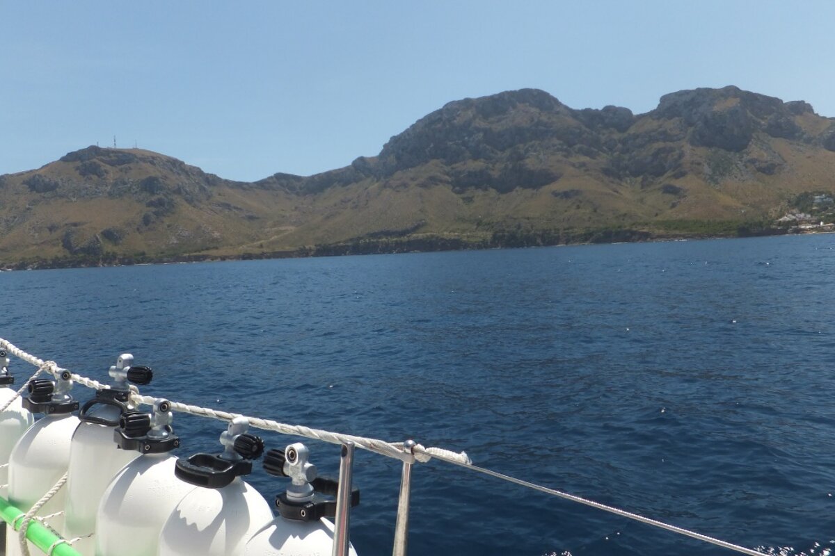 A large body of water with mountains in the background