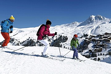 a trio of skiers in La Plagne