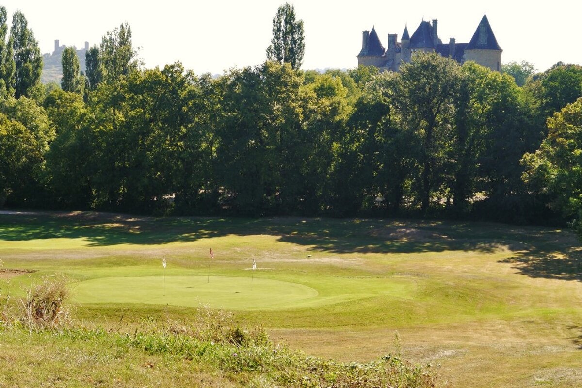 golf course with chateau Montal in background