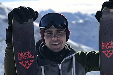 a man holding his skis