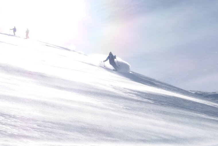 skiers off piste in val disere