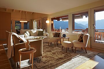 A living room with a view of the mountains