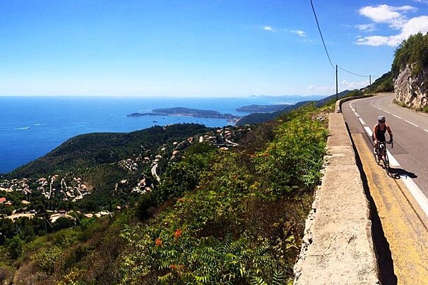 a woman cycling dressed in black lycra