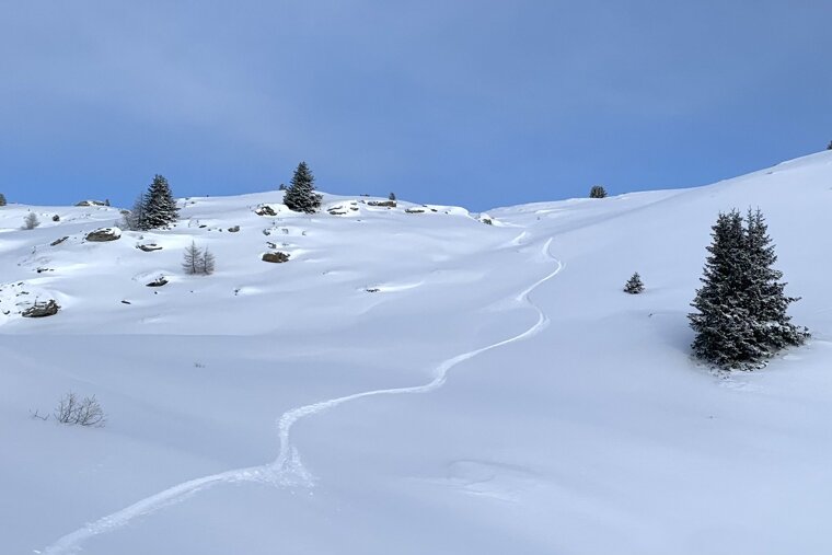 Snowy winter scene and blue skies ion La Plagne