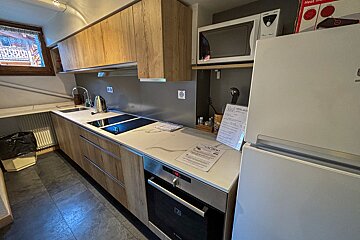 A kitchen with a sign on the counter that says hello