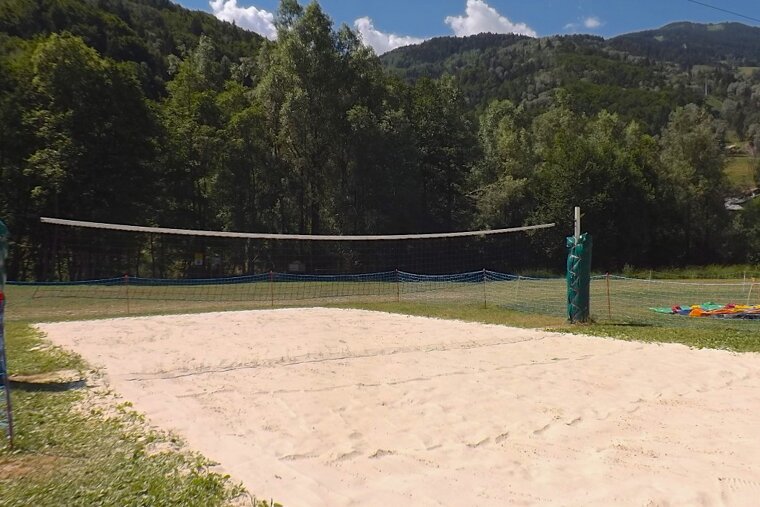 a beach volleyball court in summer