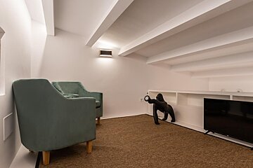 A small room with two chairs and a tv