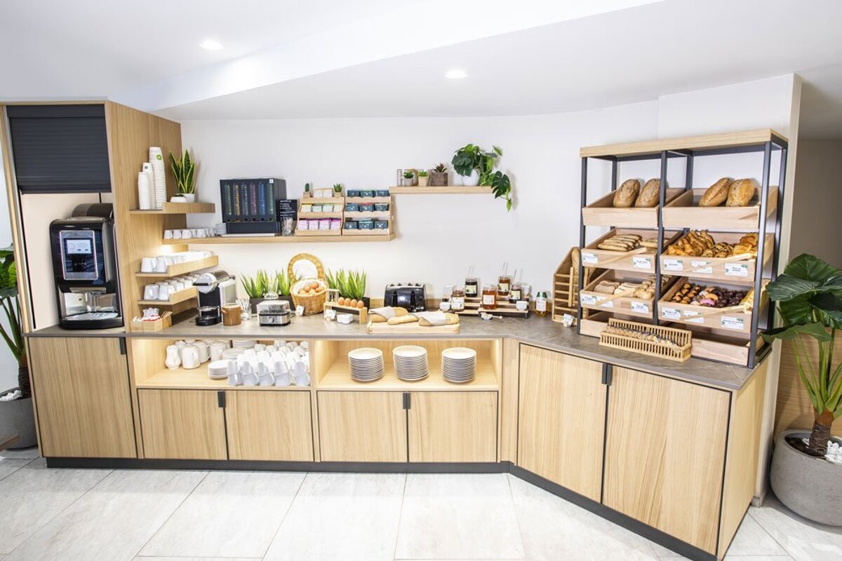 A buffet with a lot of food including bread