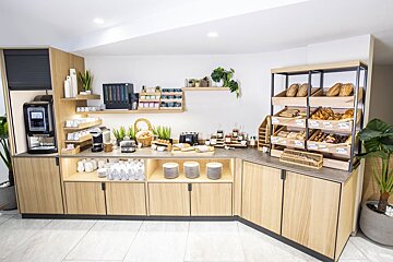 A buffet with a lot of food including bread