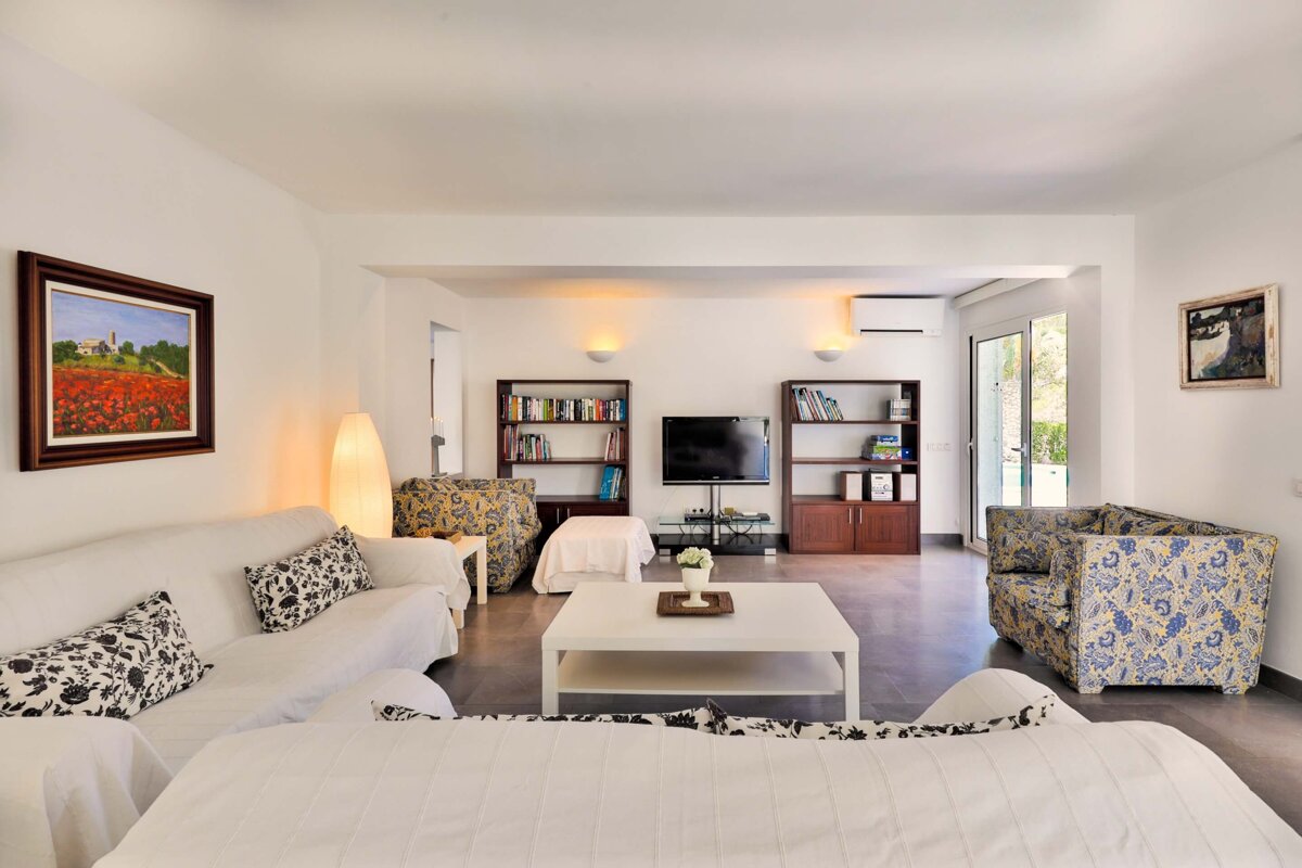 A living room filled with furniture and a television