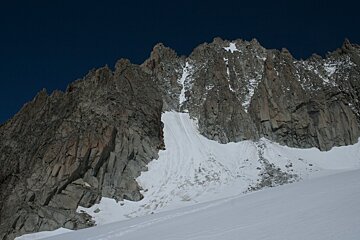 a mountain in Chamonix with not much snow
