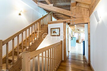A wooden staircase leading up to the second floor of a house