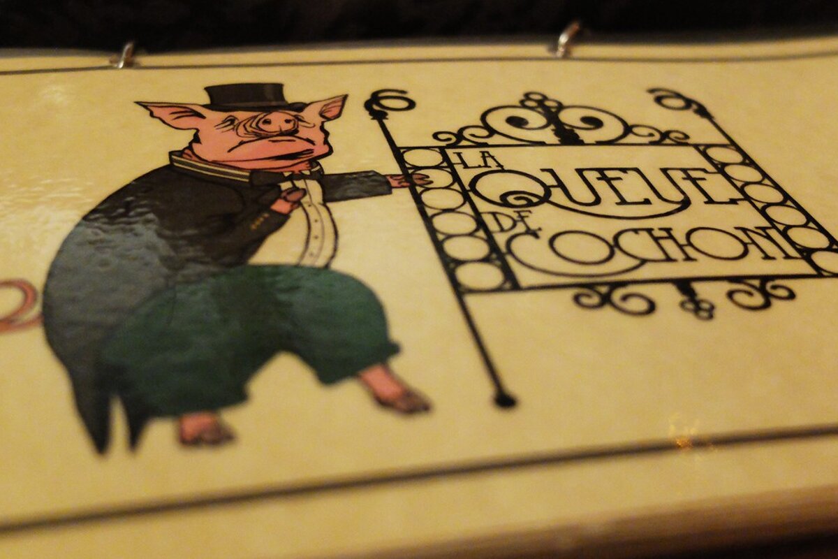 a pig drawing on a restaurant menu