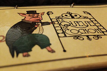 a pig drawing on a restaurant menu