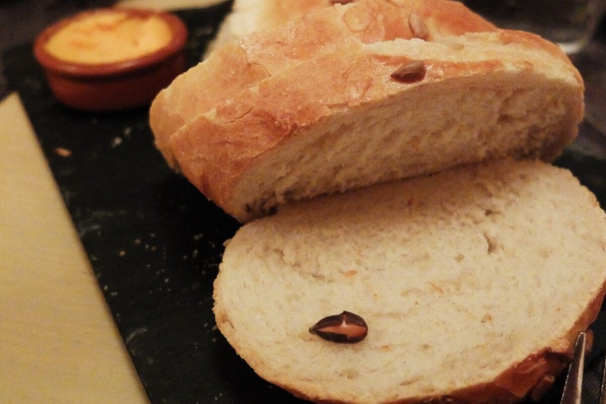 slice home made bread on a black slate